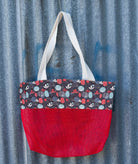 Suncheeter Sandshaker sand free beach bag in red with a patterned panel and shoulder straps